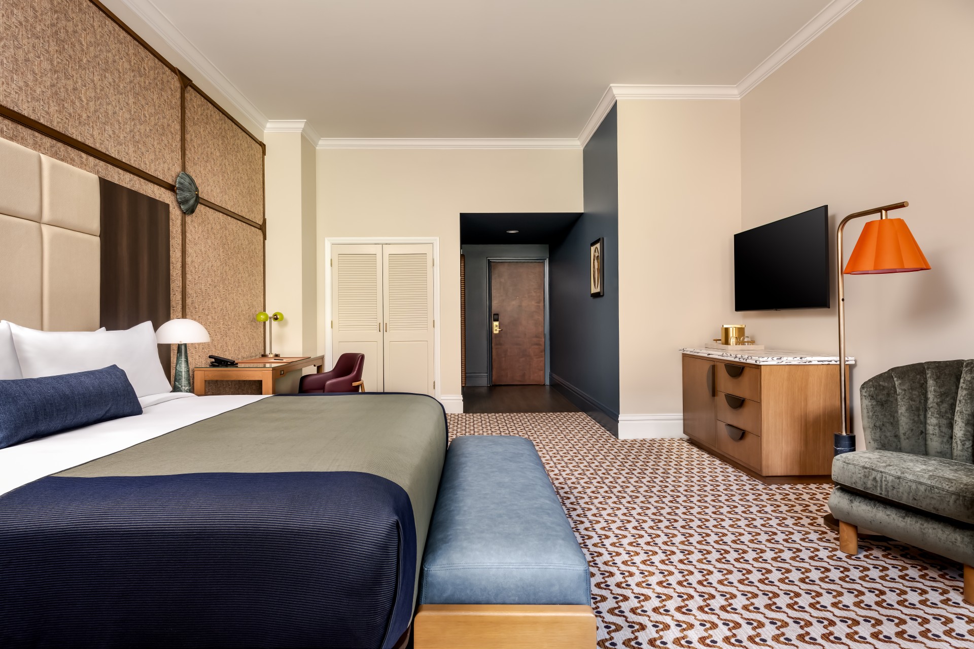 a room with a bed and a tv