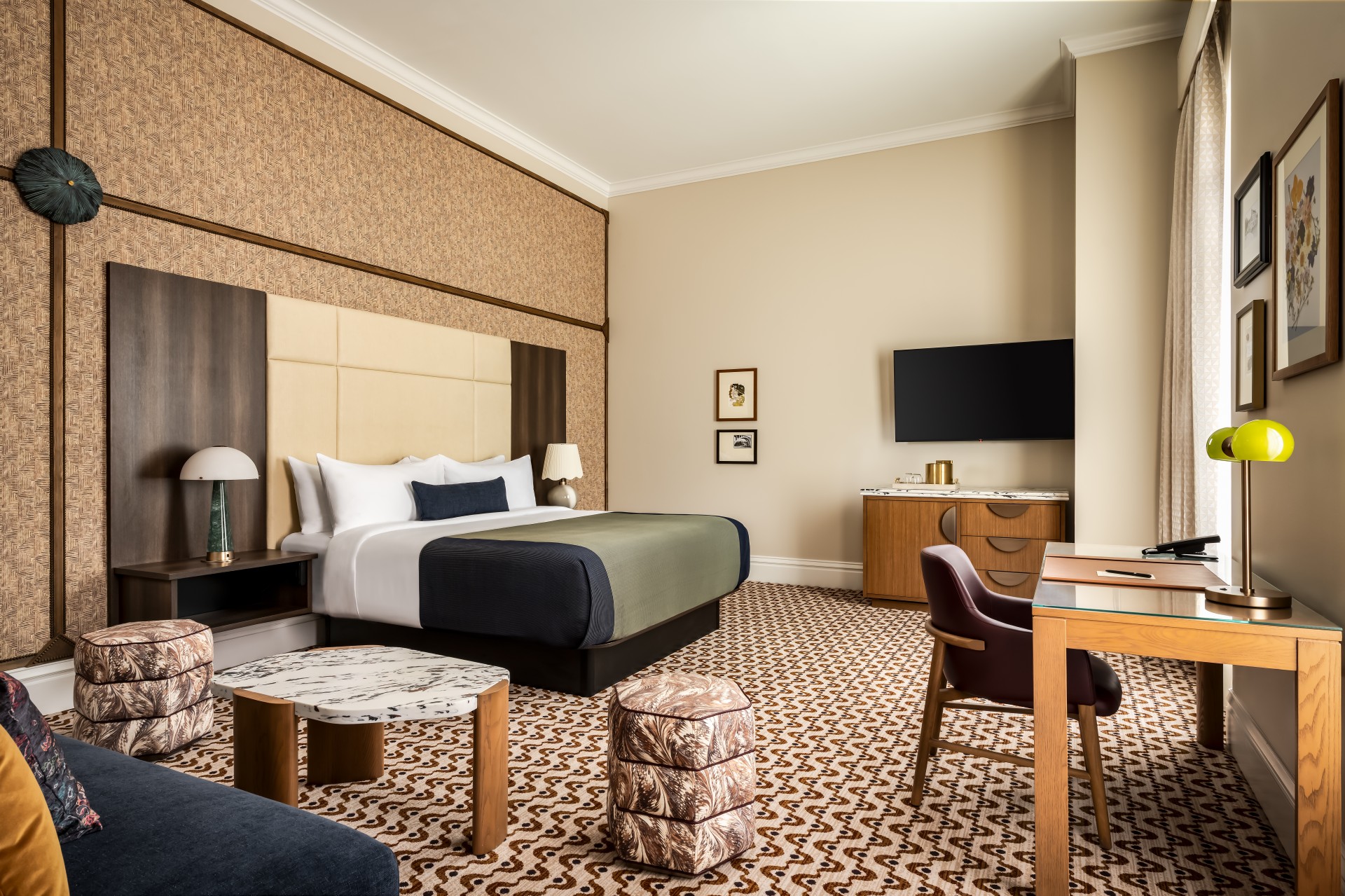 a room with a bed and a television