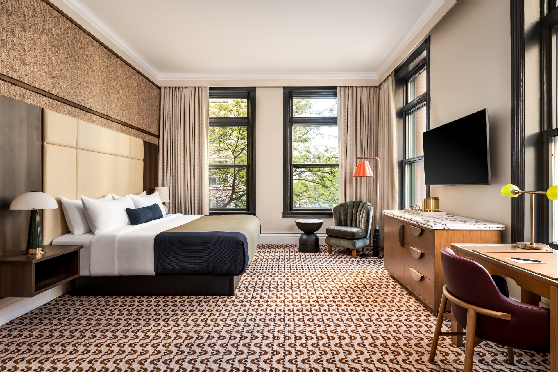 a room with a bed and a television