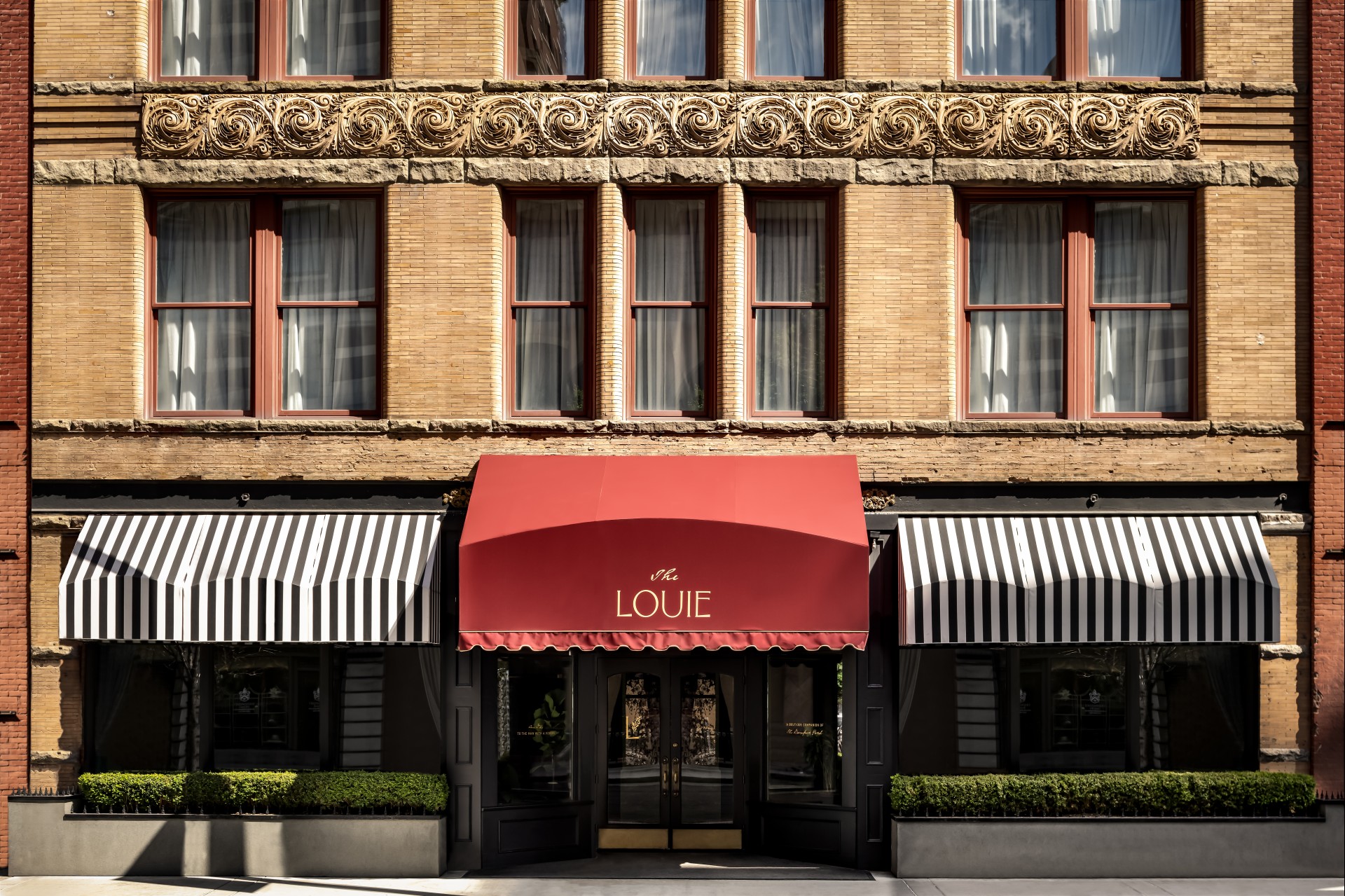 a building with a red awning