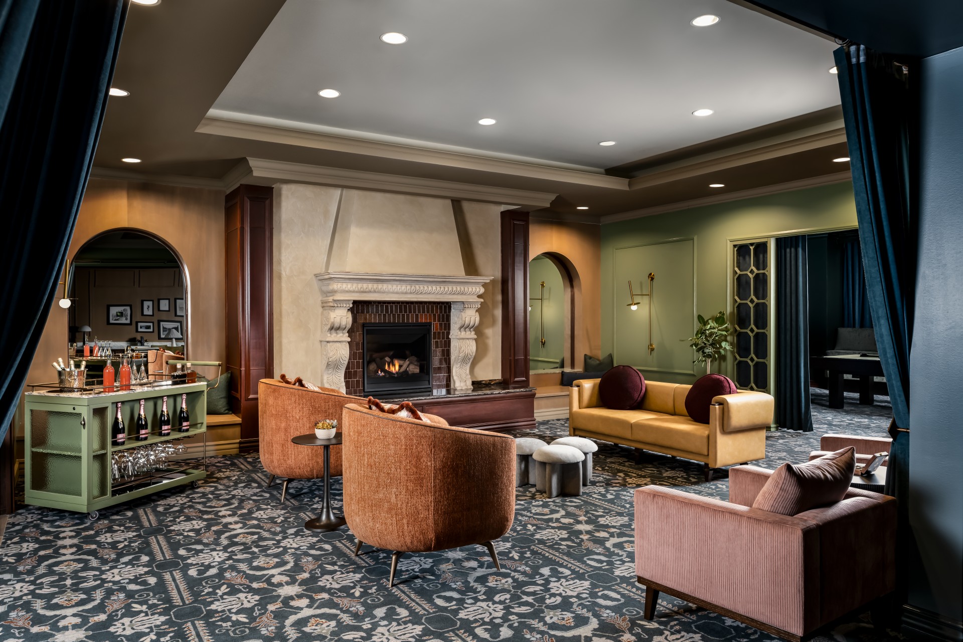 a room with a fireplace and chairs