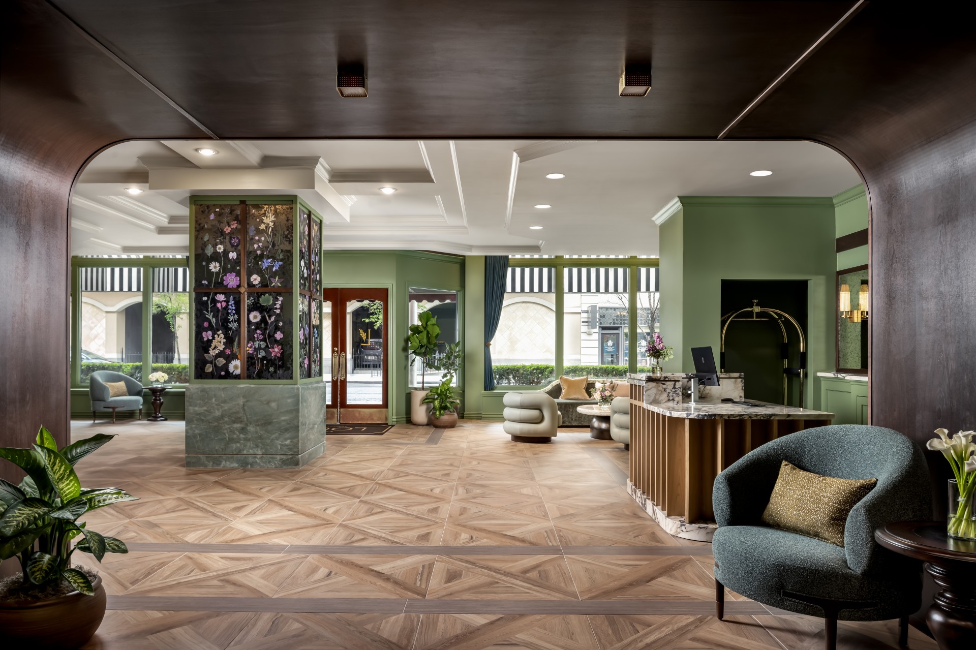 a lobby with a reception desk and chairs