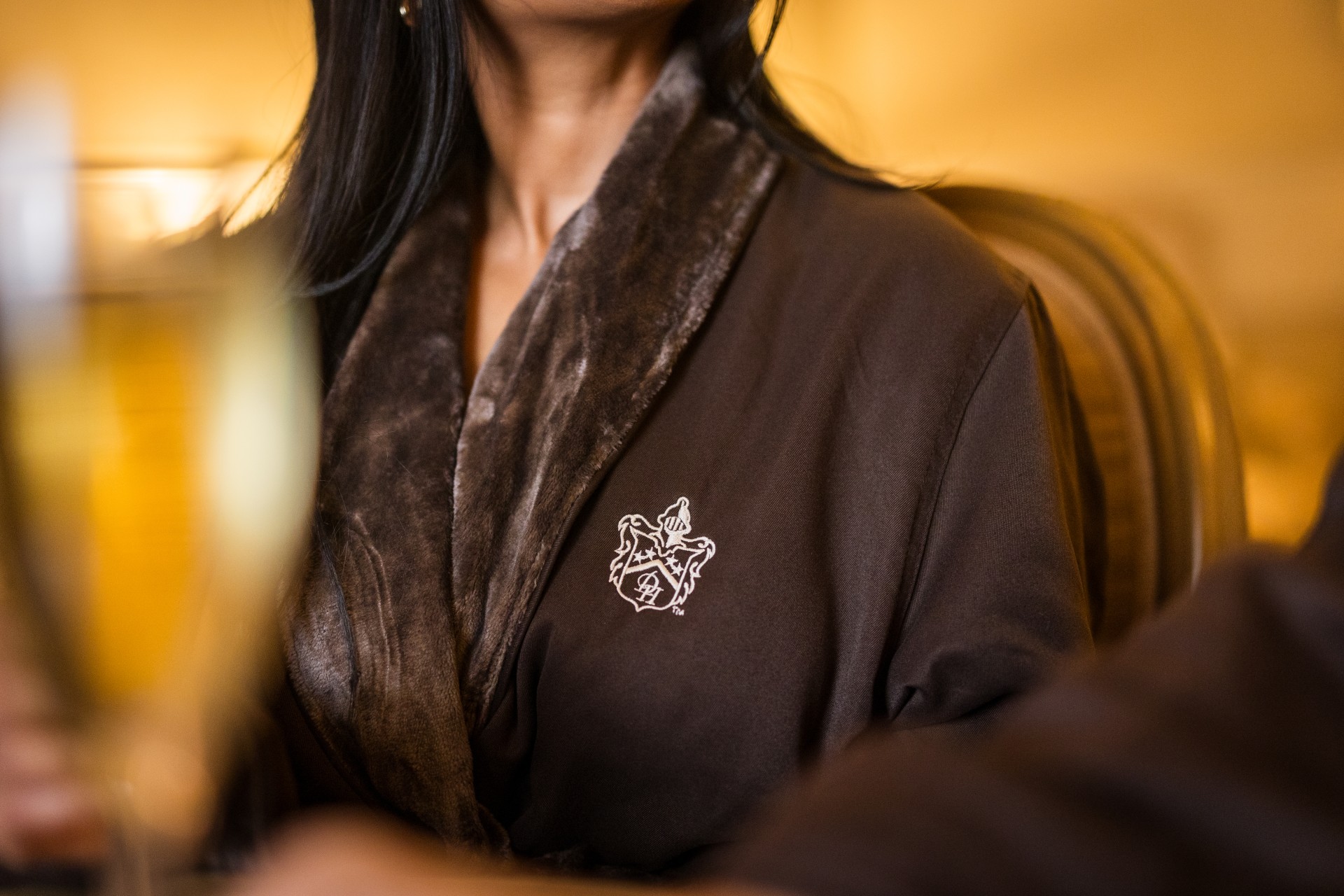 a woman wearing a brown robe