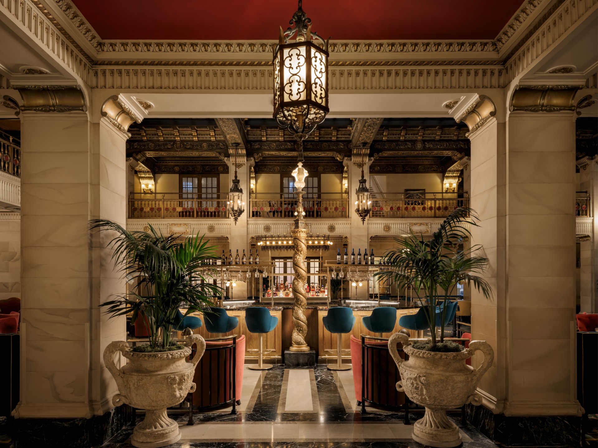 a room with a bar and a gold pole