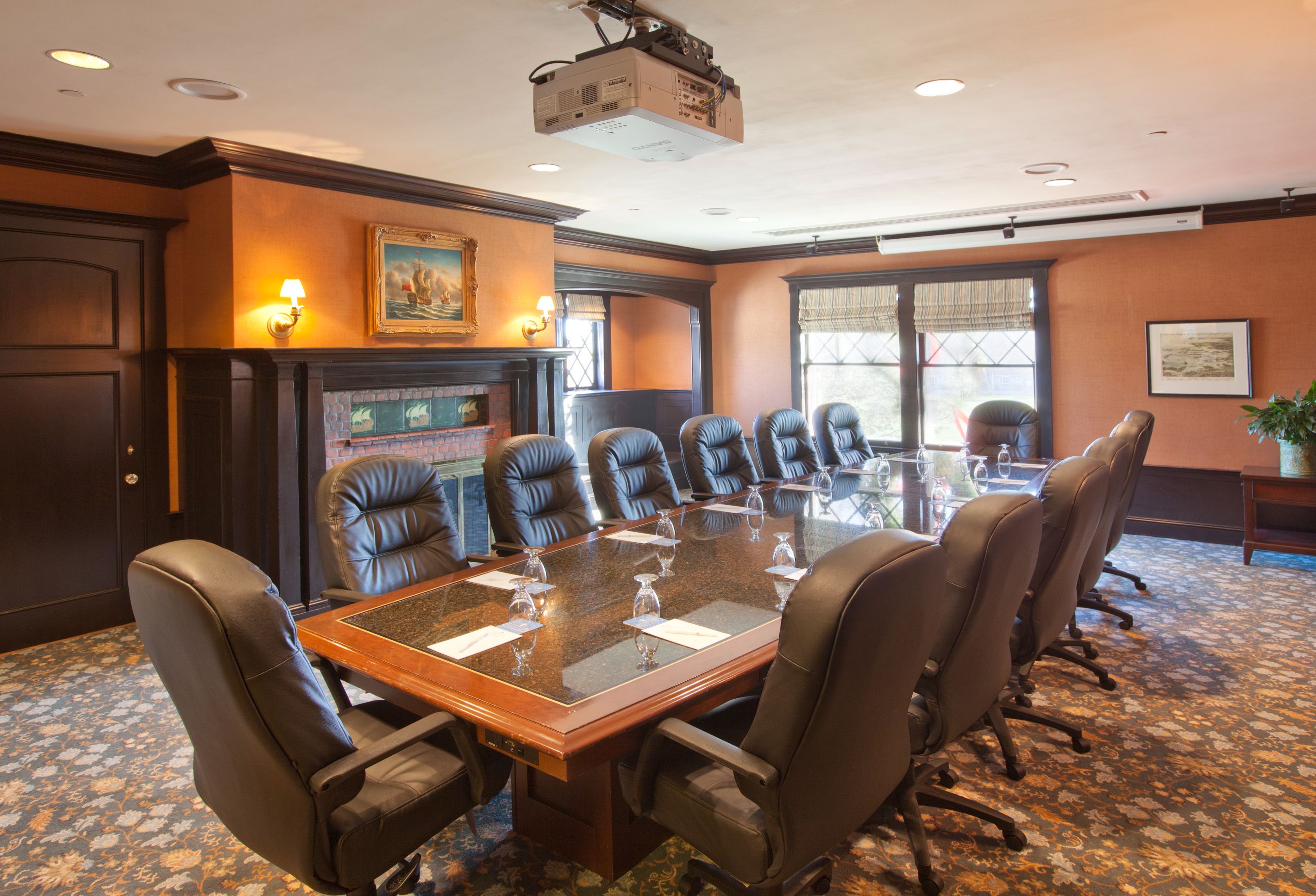 a conference room with a table and chairs
