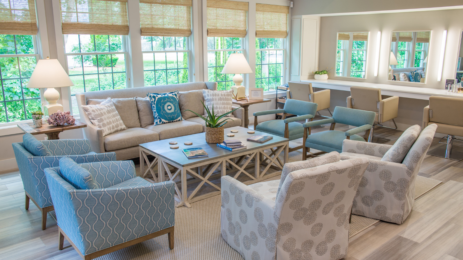 a living room with couches and chairs