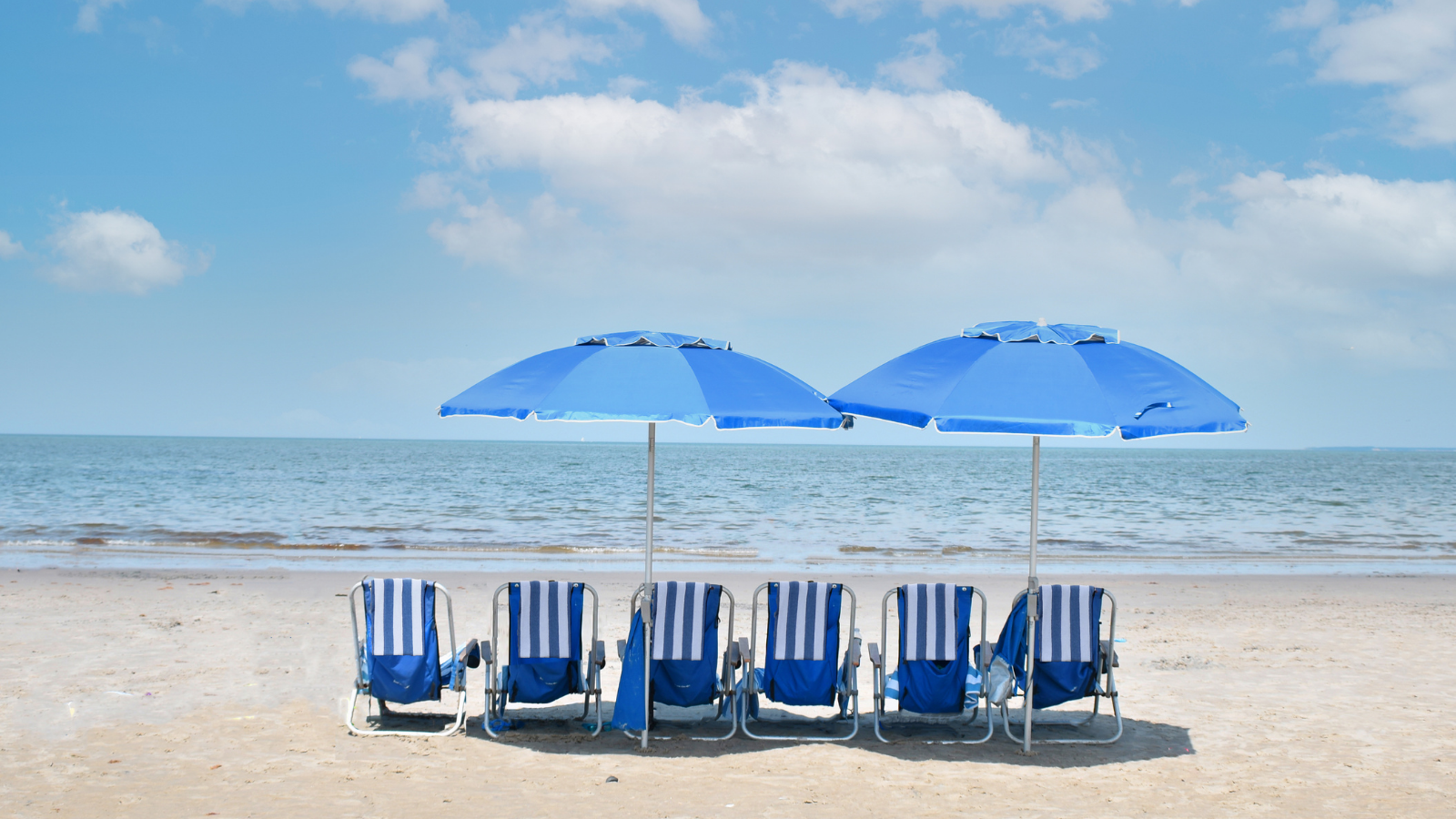 chairs and umbrellas on a beach