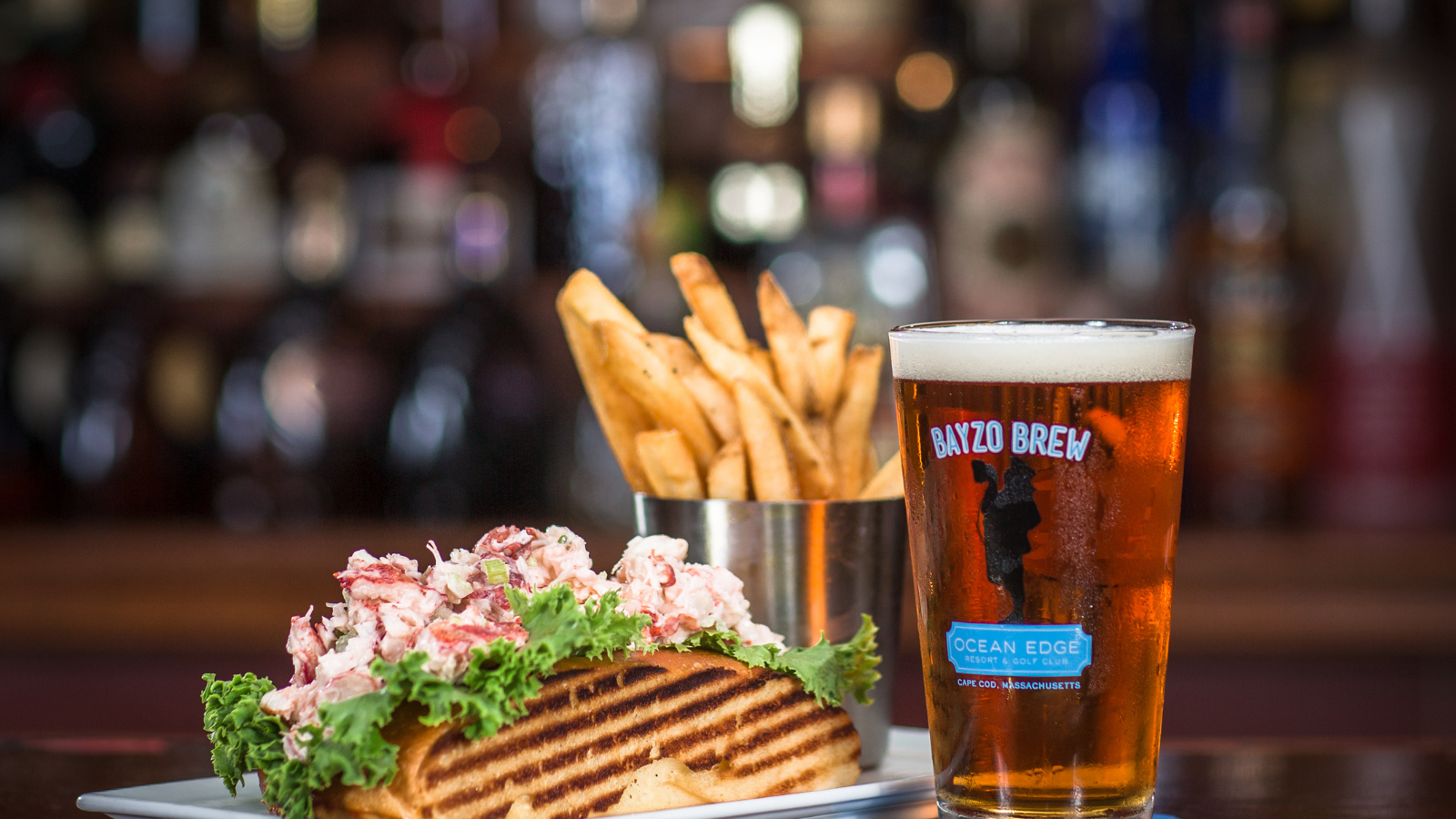 a plate of food and a glass of beer