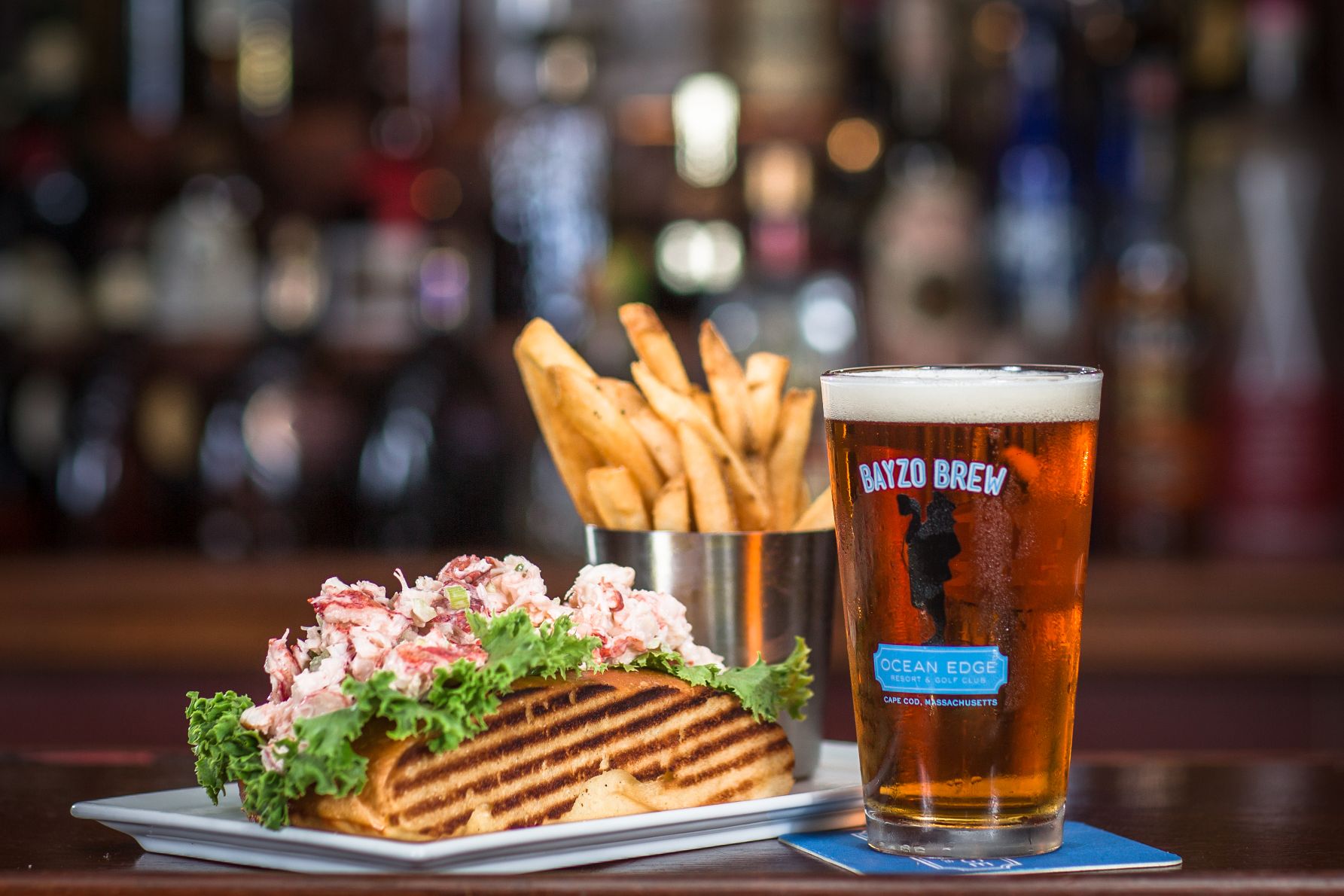 a plate of food and a glass of beer