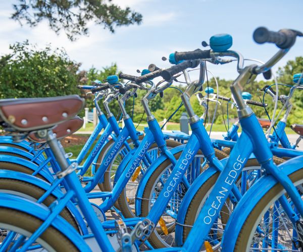 a row of blue bicycles