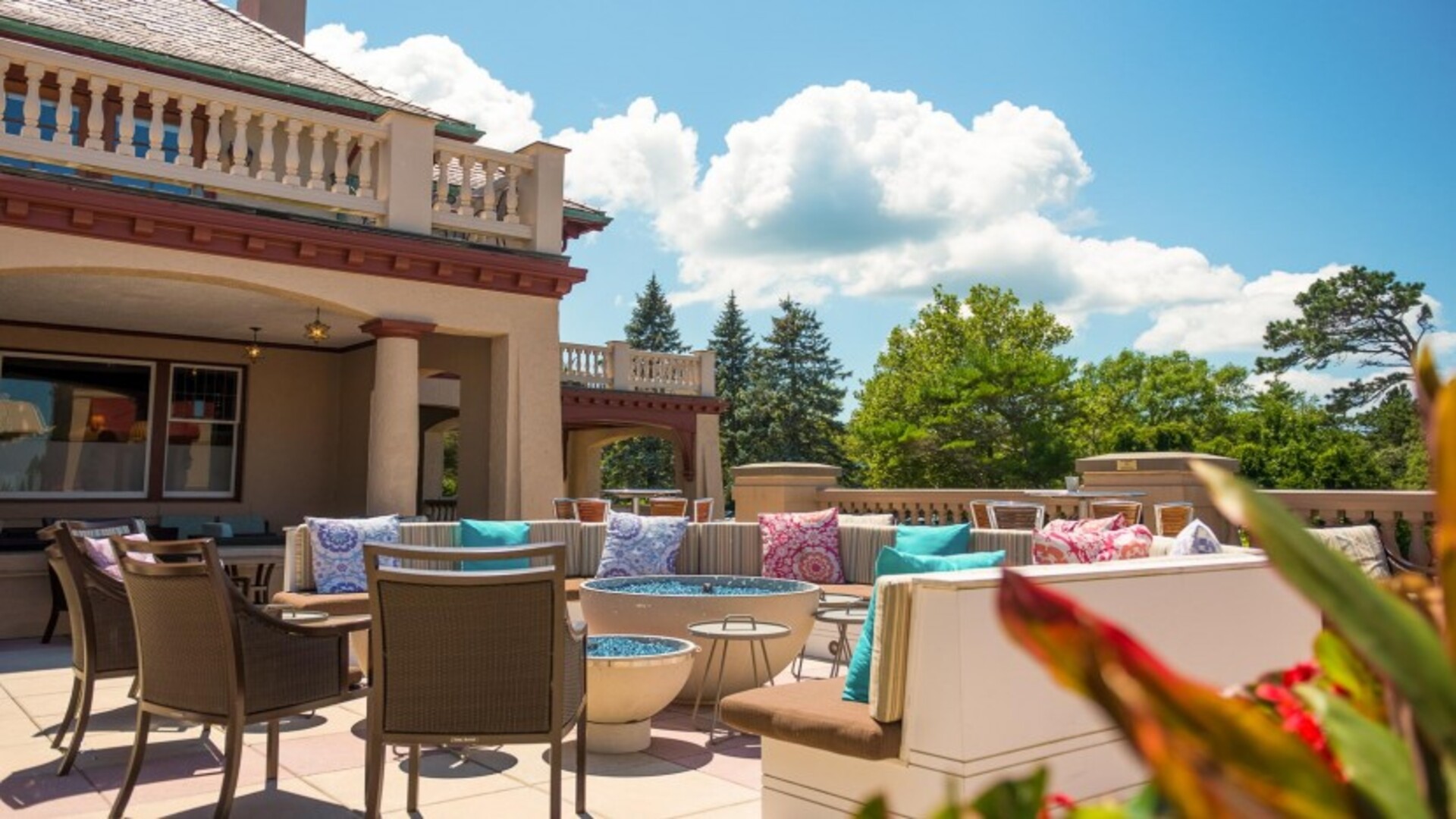 a patio with furniture and a fire pit