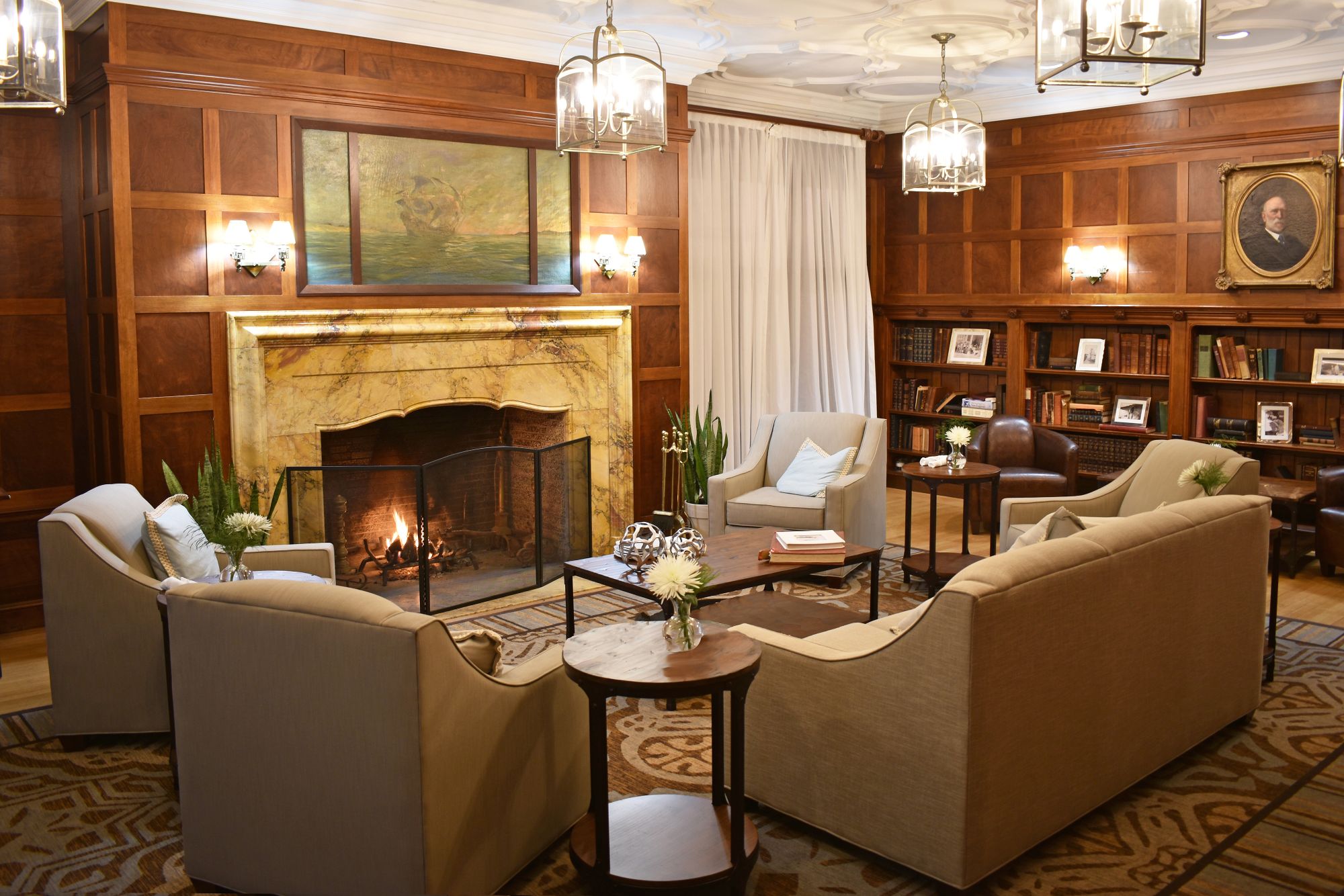 a room with a fireplace and couches