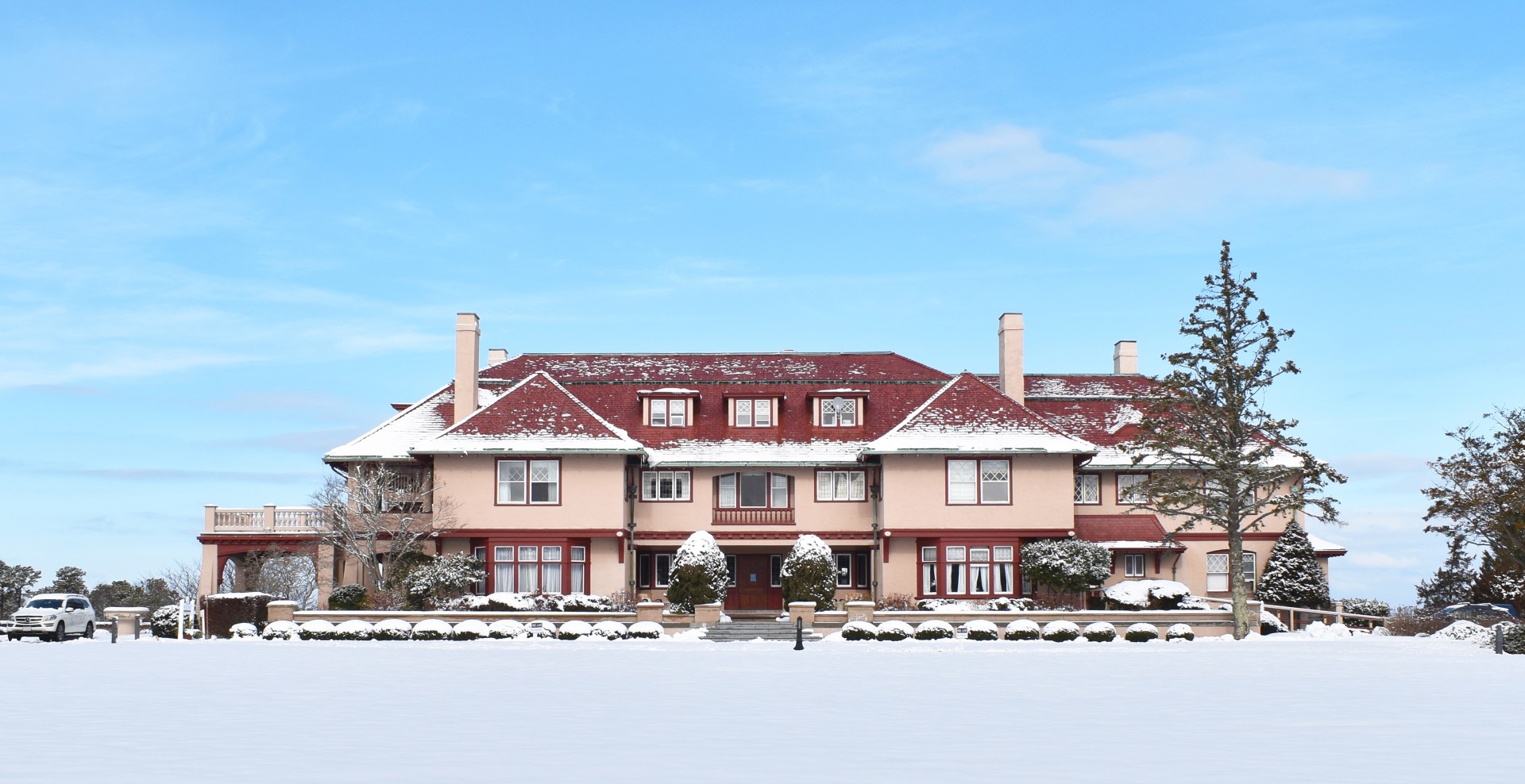 a large house with snow on the ground