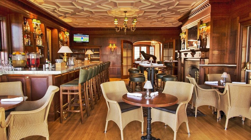 a bar with chairs and tables