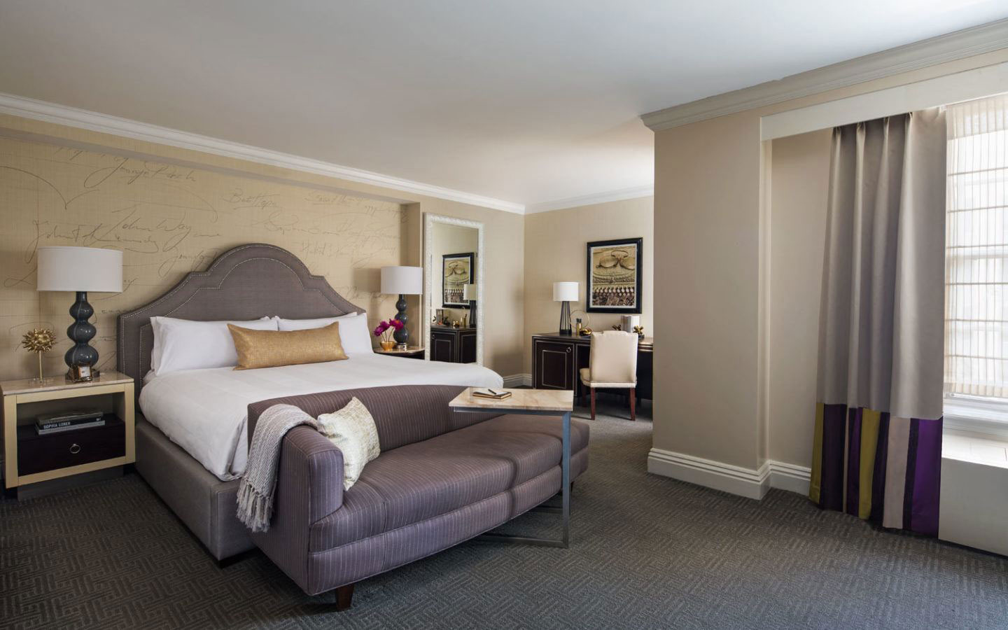 a bedroom with a bed and a couch