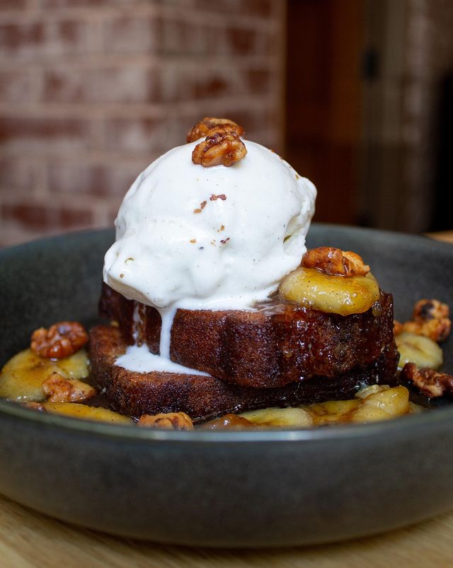 a plate of food with ice cream and bananas
