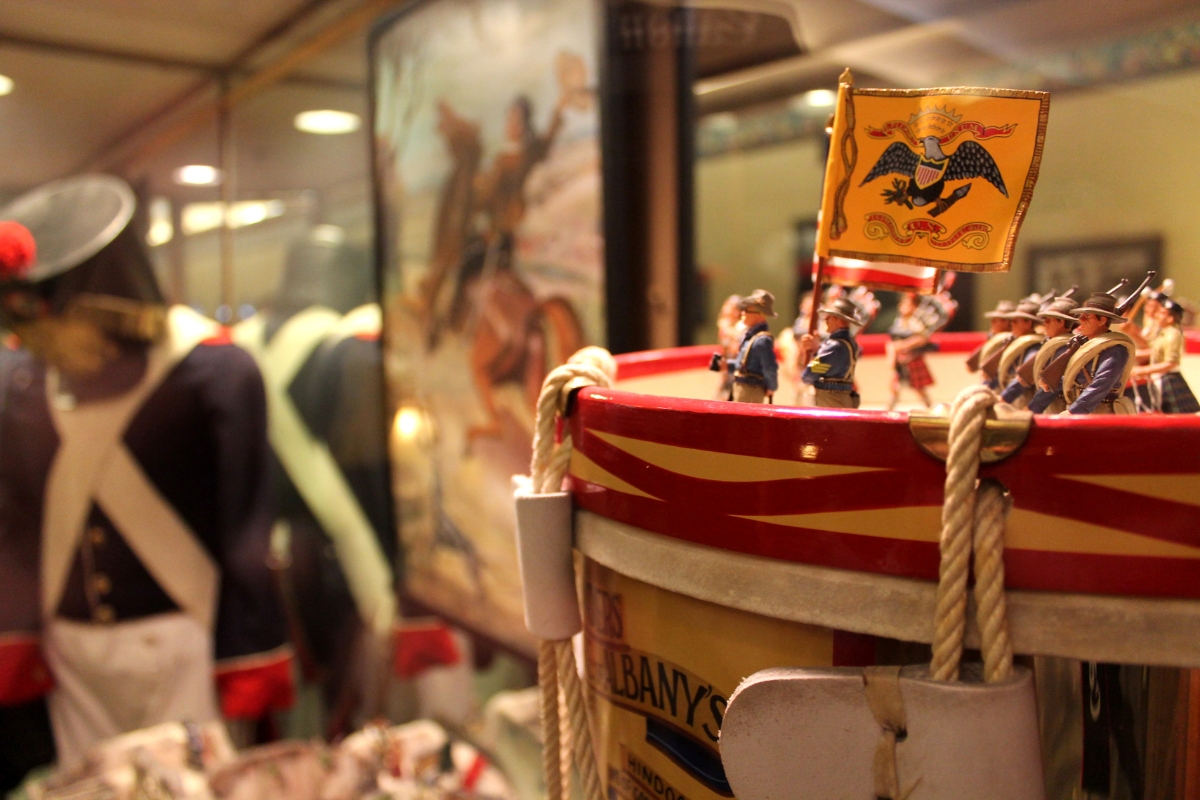 a toy drum with a flag on it