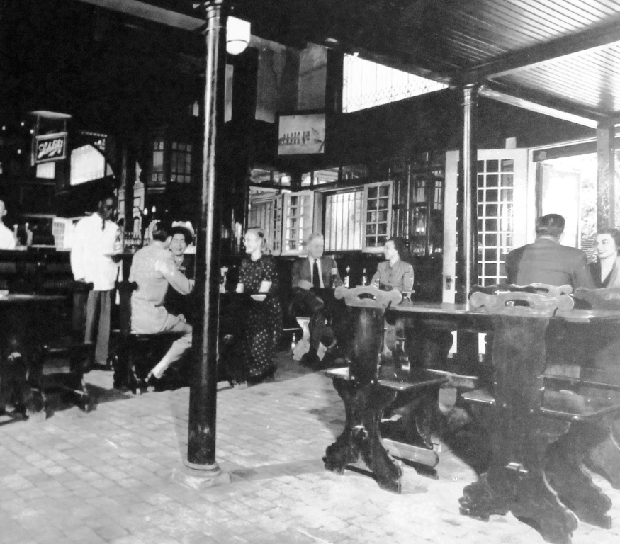 a group of people sitting in a bar