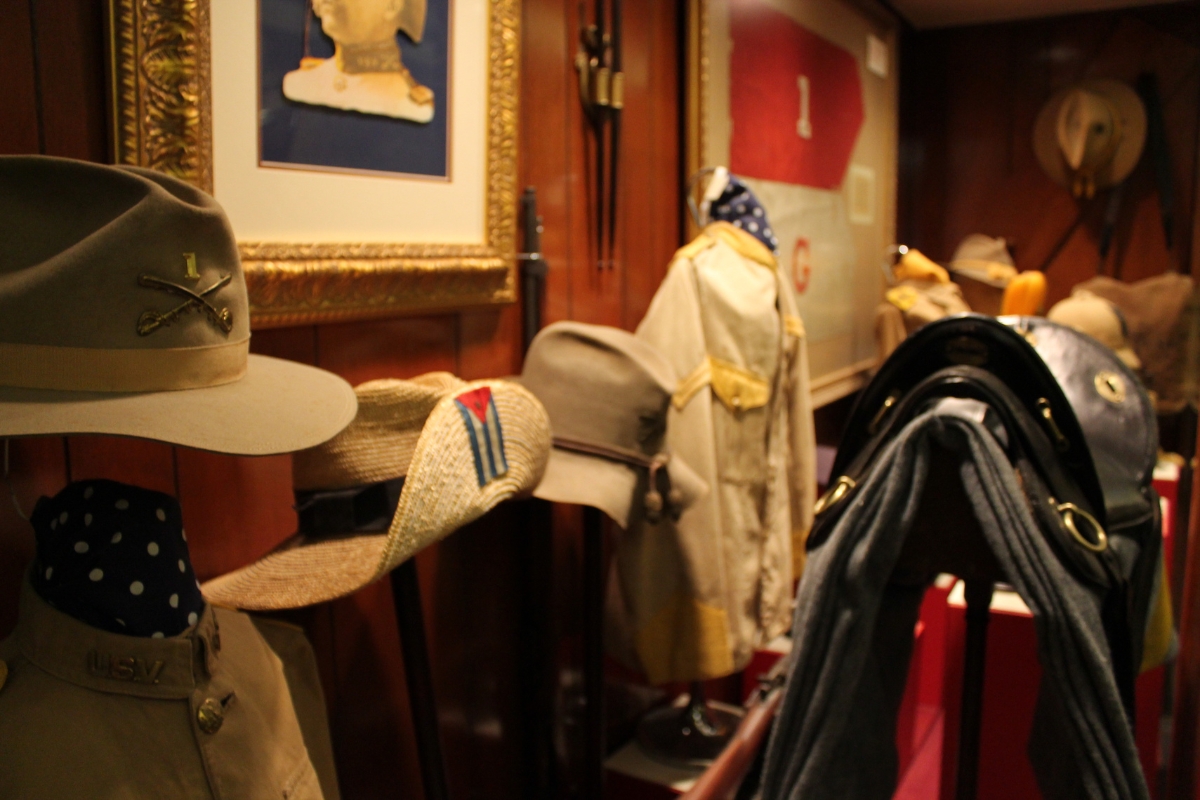 hats and coats on a wall
