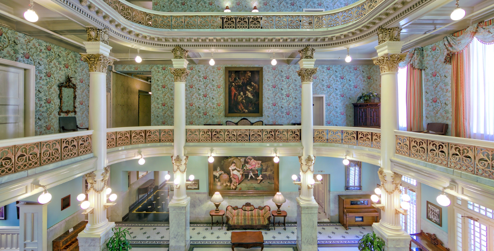 a large building with columns and a painting