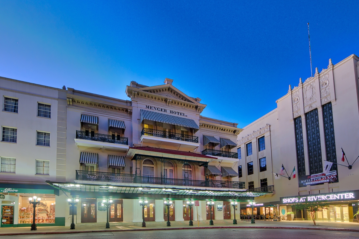 a building with a balcony and a street in front