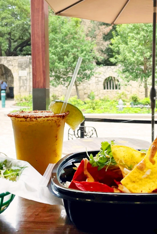a plate of food with a drink and a drink in it
