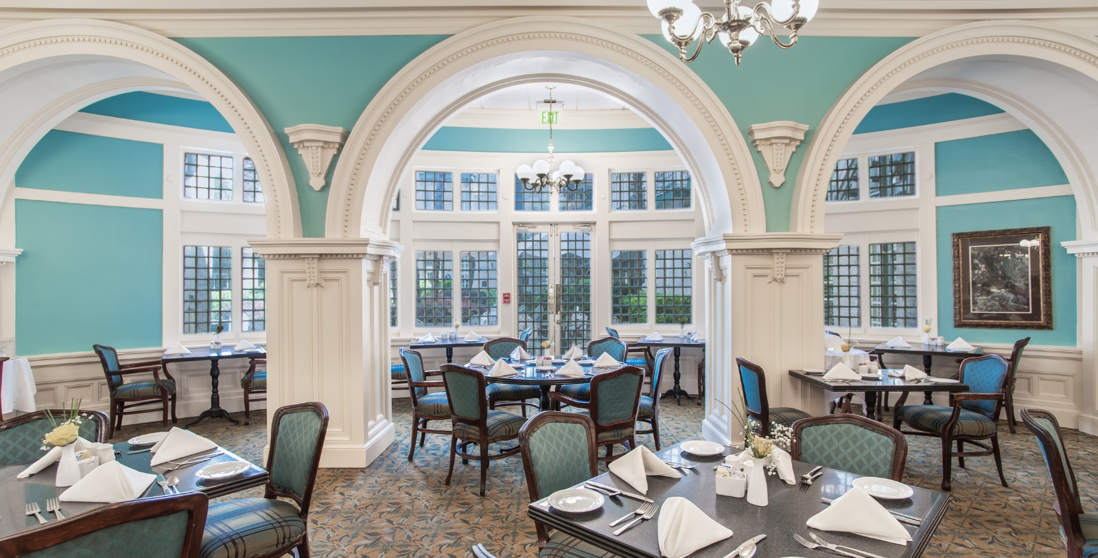 a room with tables and chairs