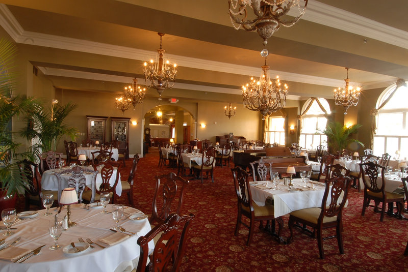 a restaurant with tables and chairs