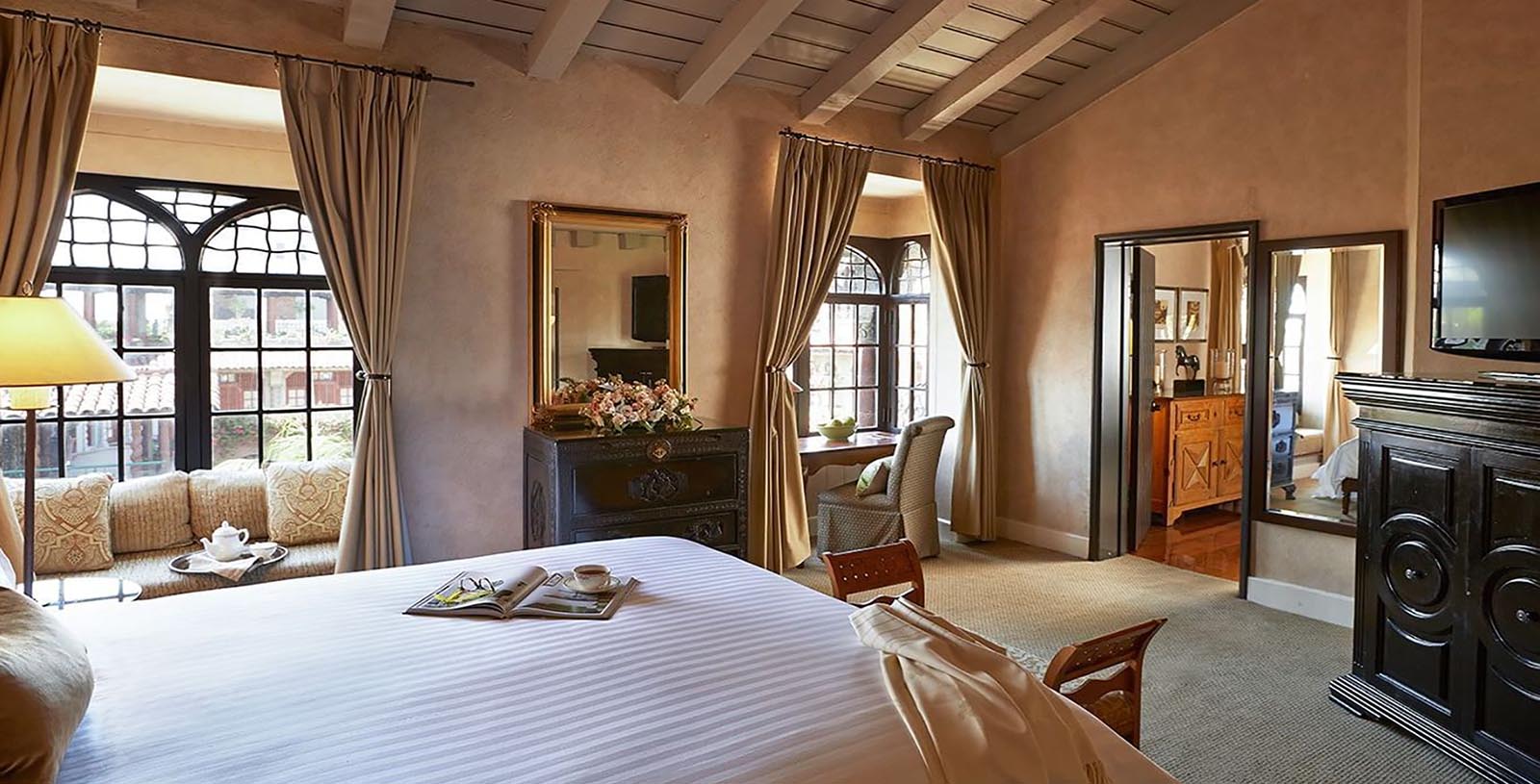 a bedroom with a bed and a mirror
