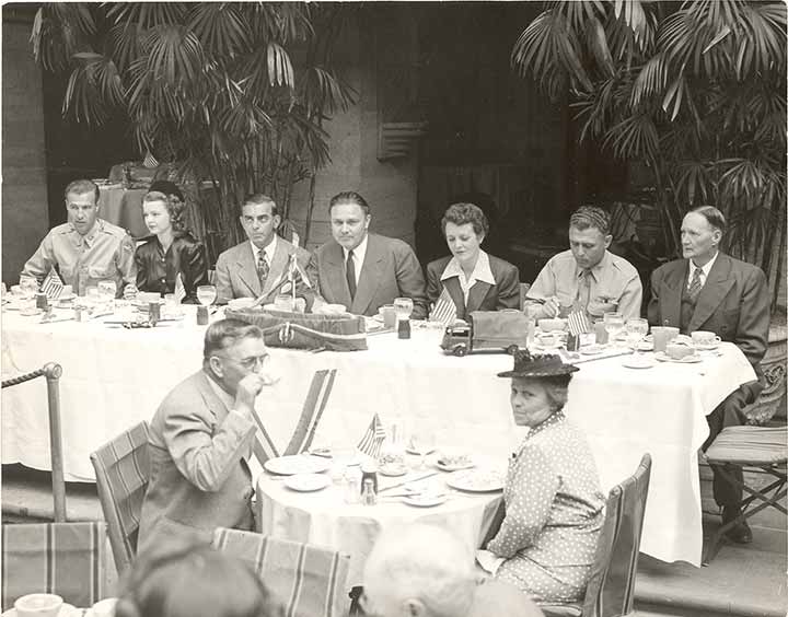 a group of people sitting around a table