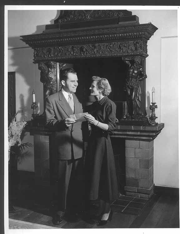 a man and woman standing next to each other