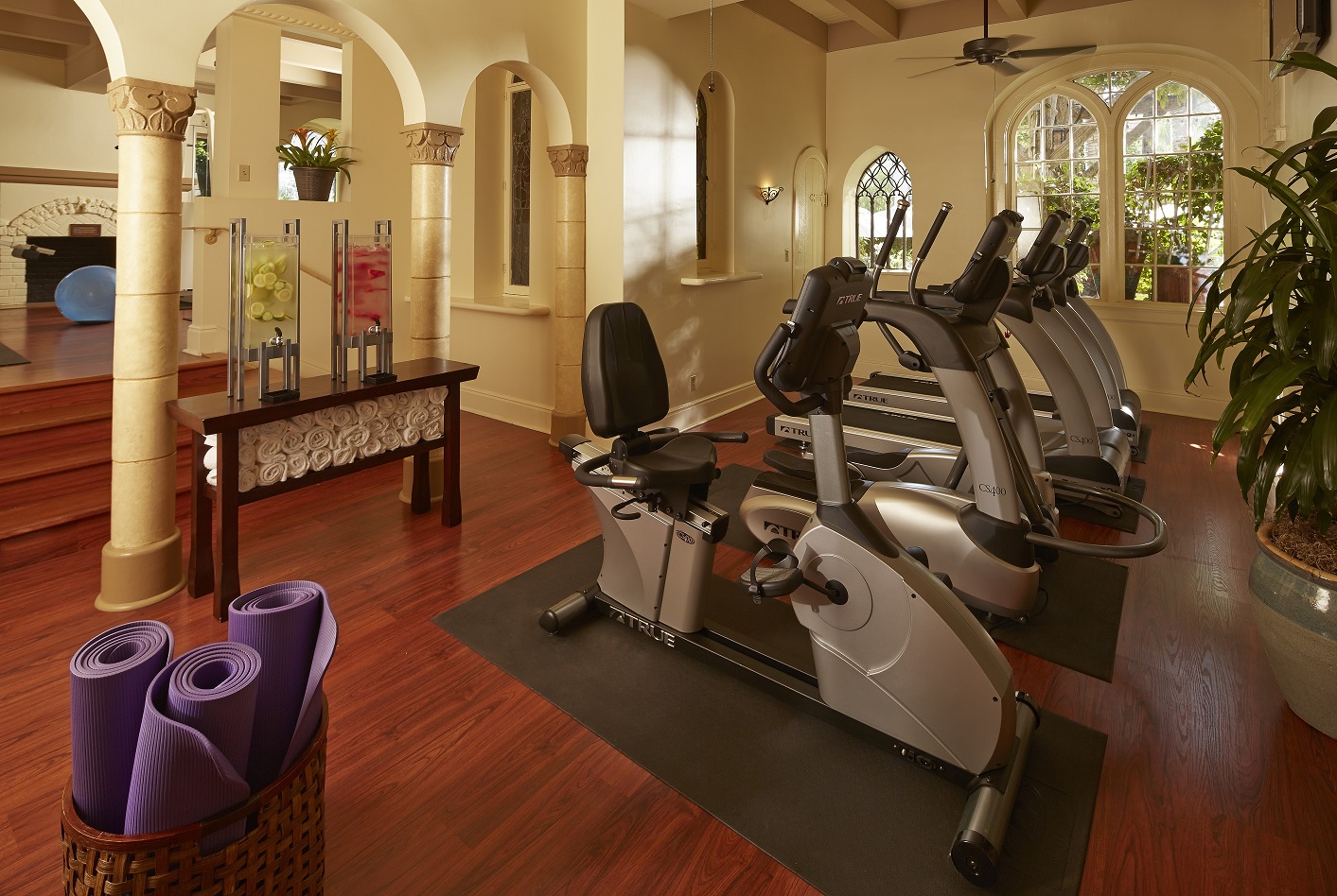 a room with exercise bikes and yoga mats