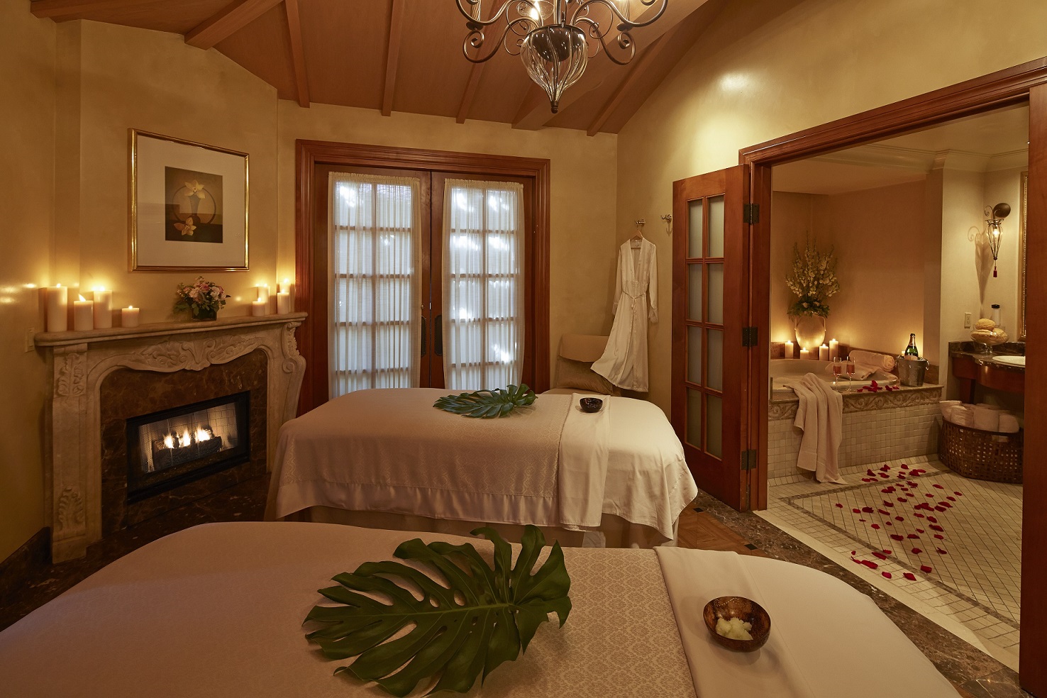 a room with a fireplace and a couple beds