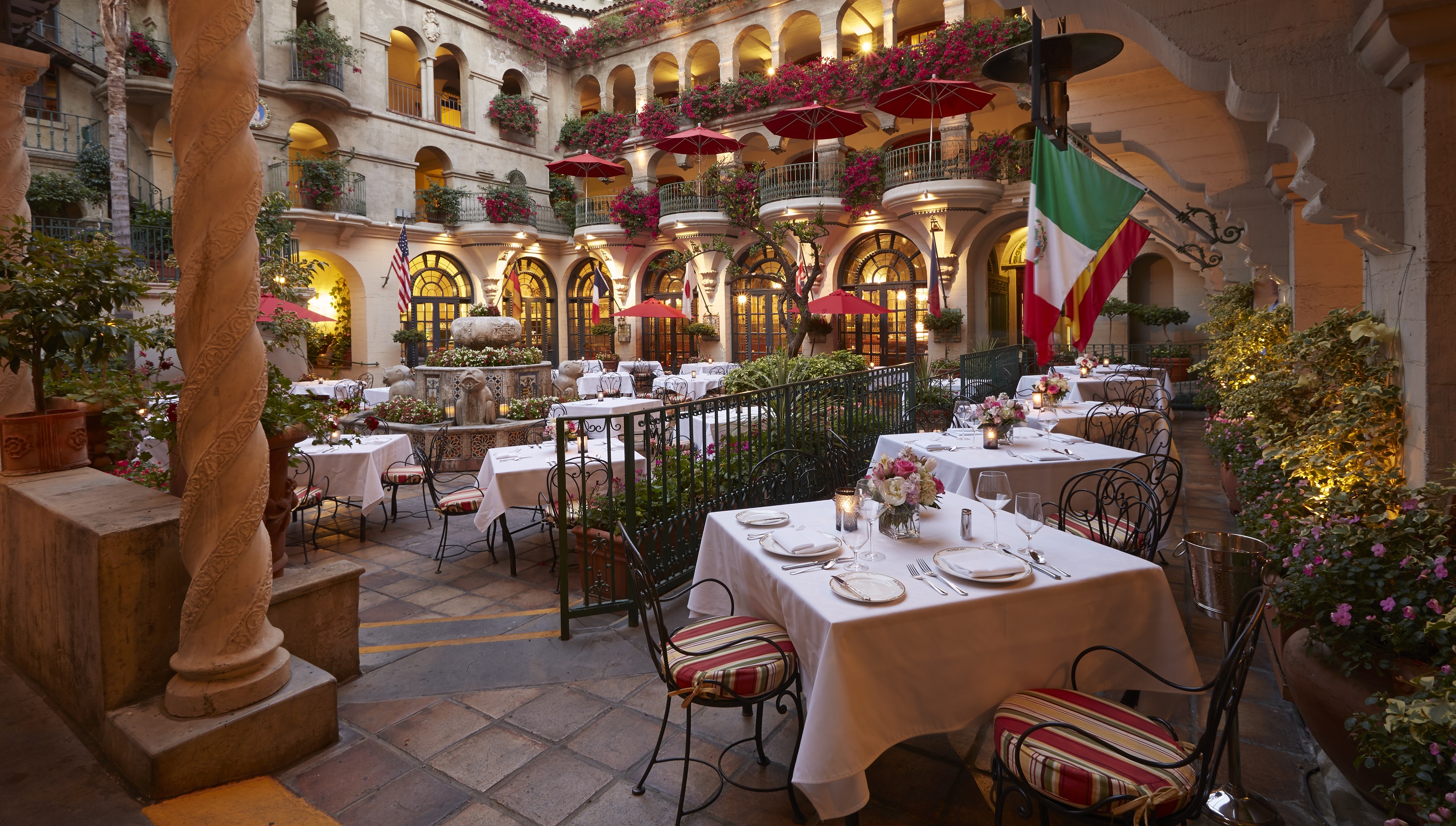 a courtyard with tables and chairs