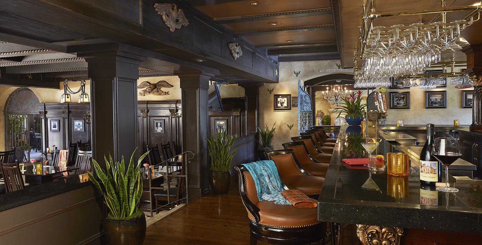 a bar with chairs and a table