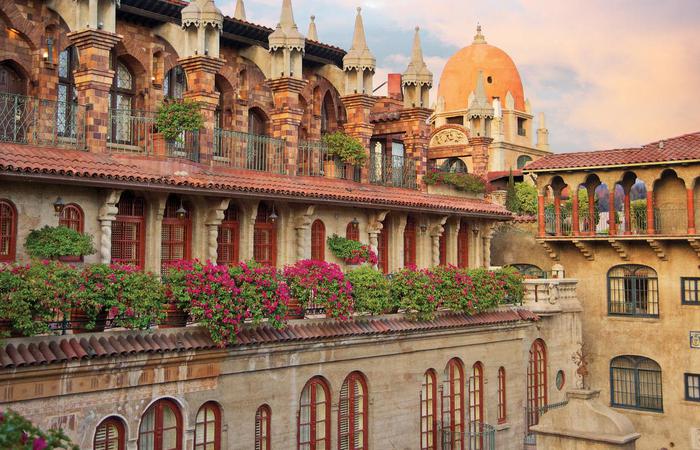 a building with many windows and flowers