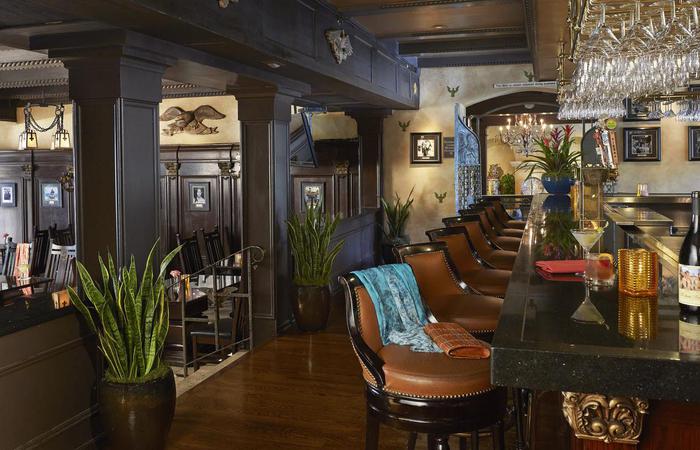 a room with chairs and a bar