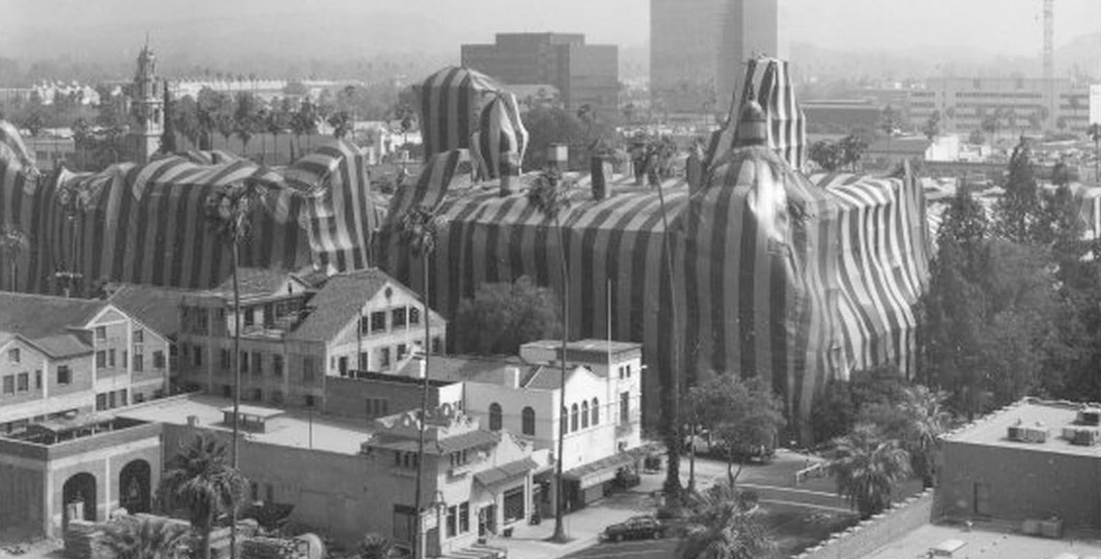 a large inflatable elephant in a city