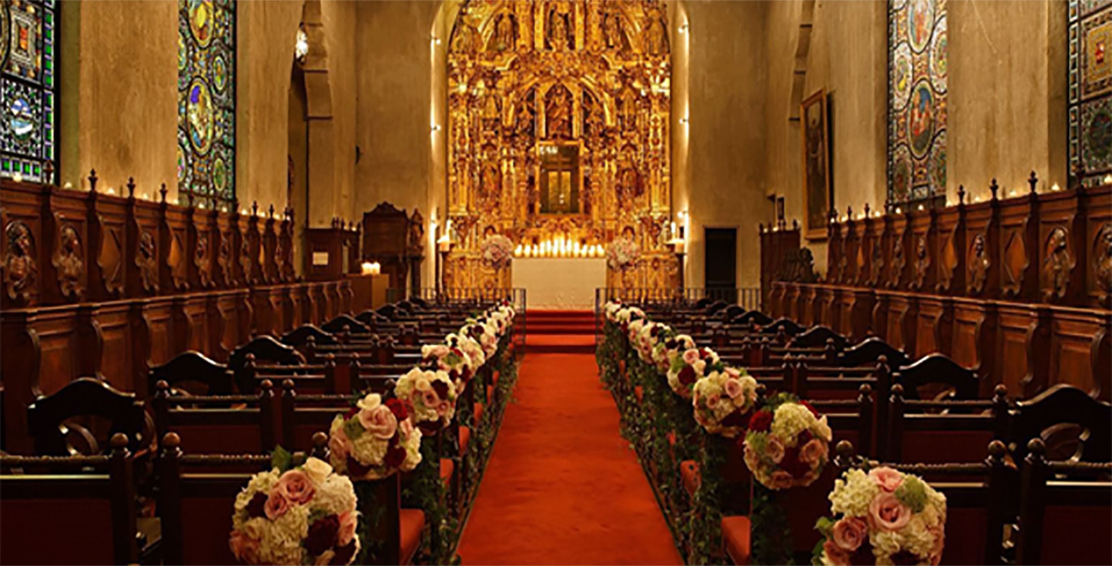 a church with chairs and flowers