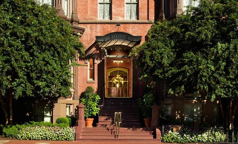 a building with stairs and trees