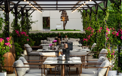 a patio with tables and chairs