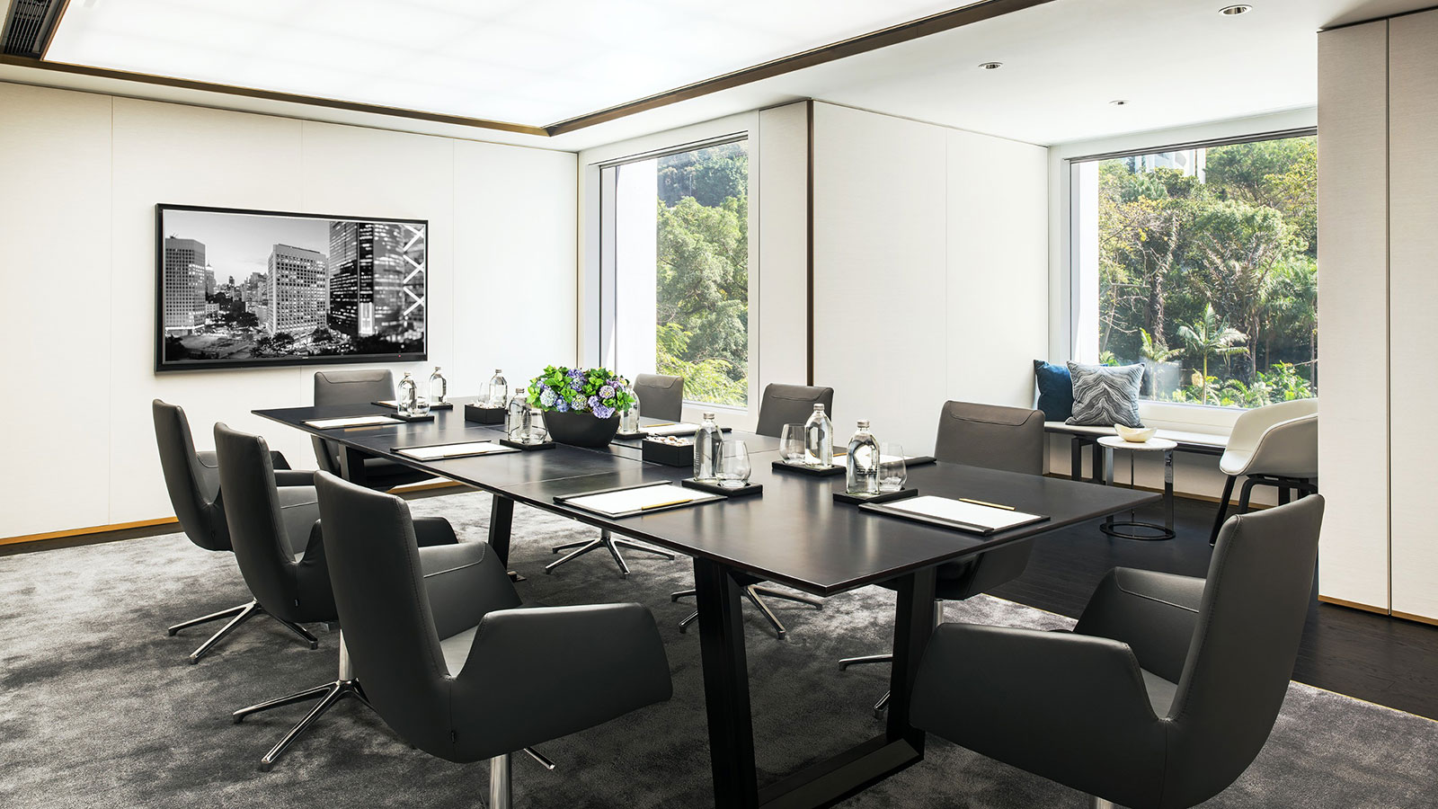 a conference room with a large table and chairs