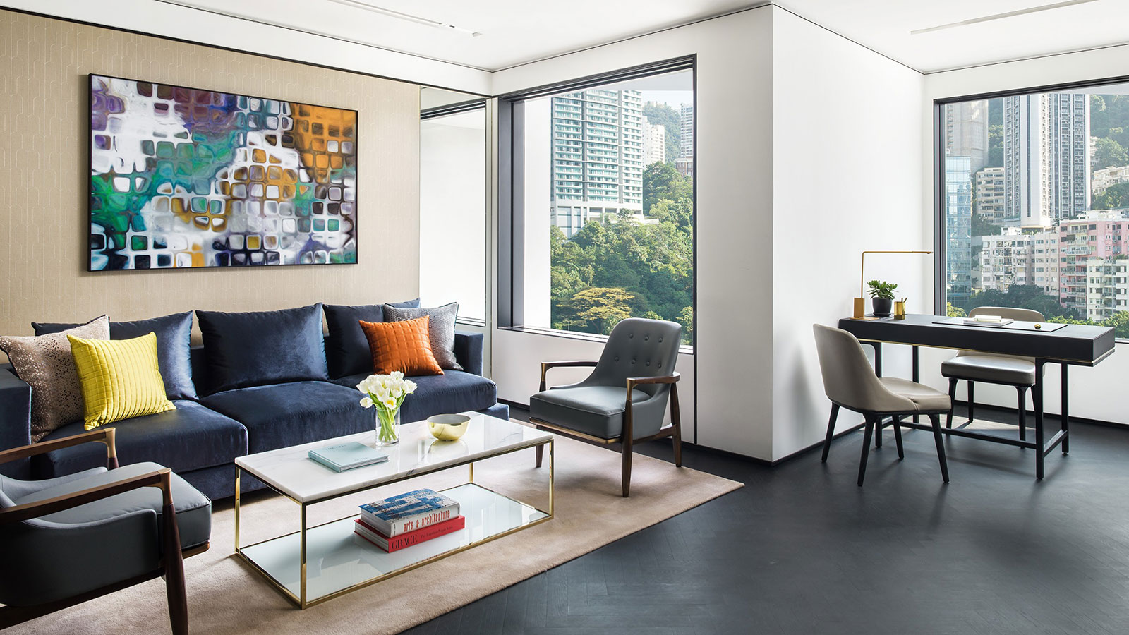 a living room with a blue couch and a coffee table