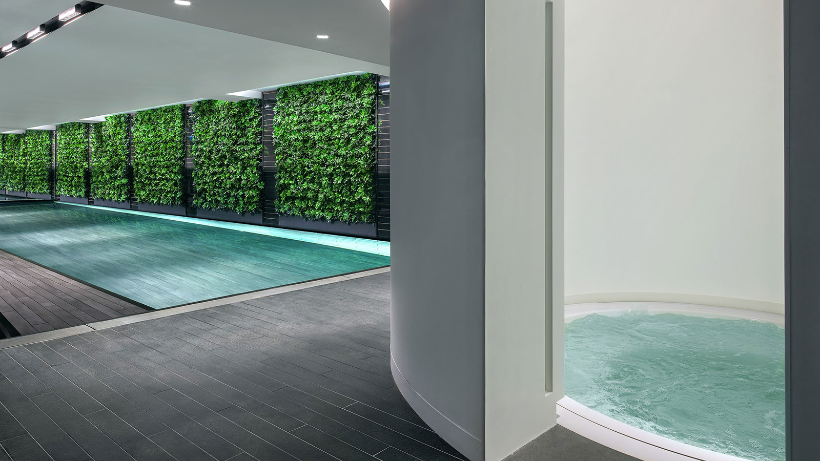 a indoor pool with a hot tub
