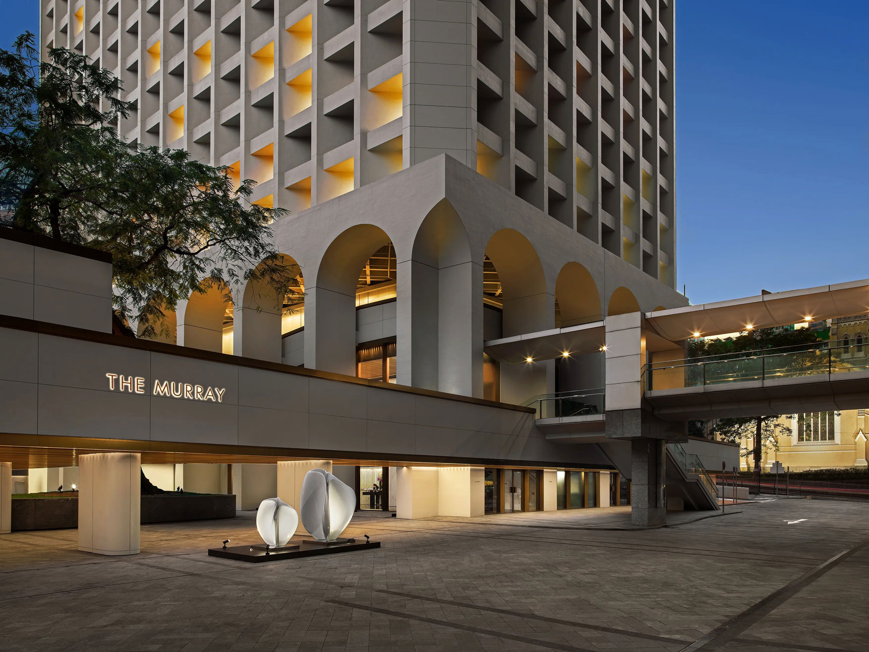 a building with a walkway and a walkway