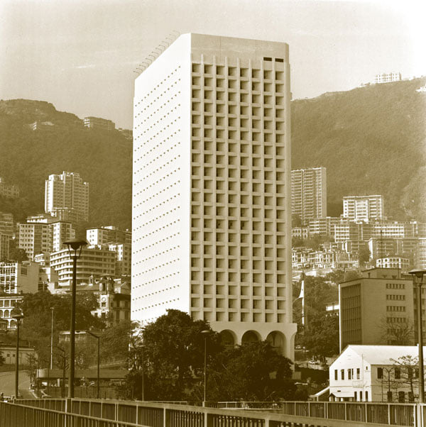 a tall white building with many windows