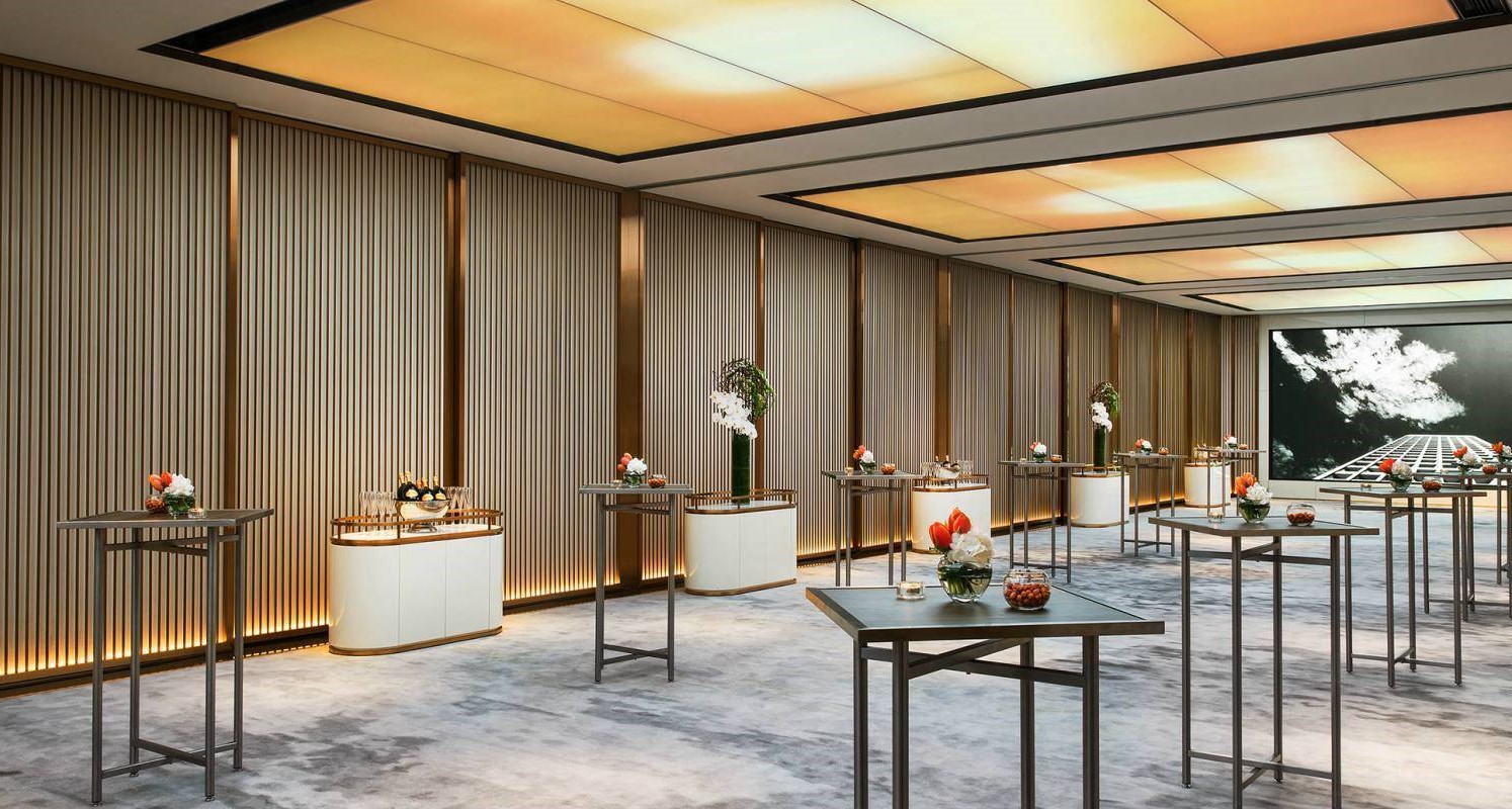 a room with tables and vases