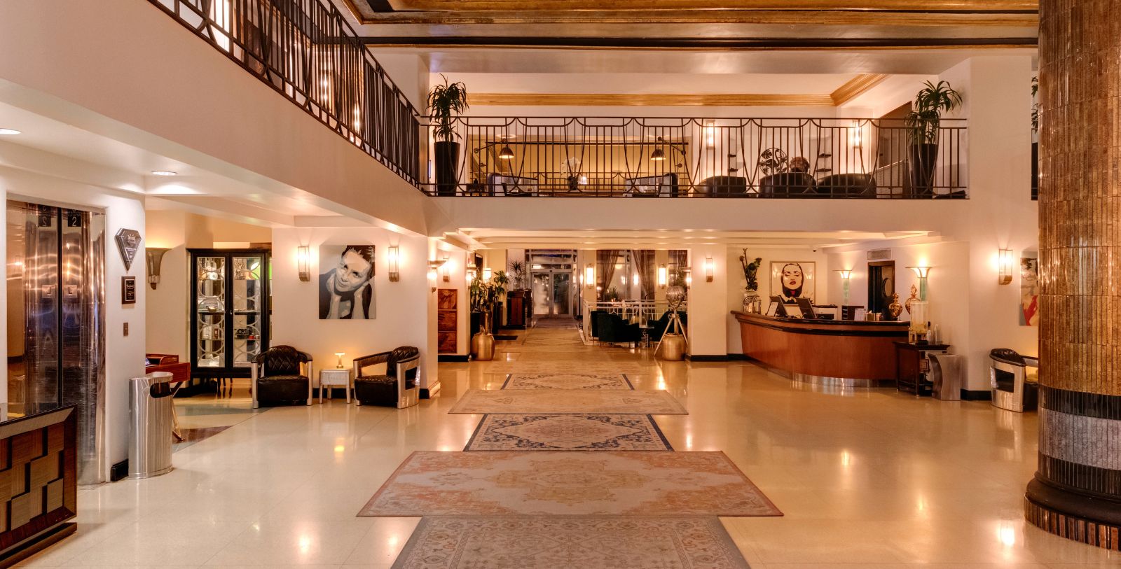 a large hall with a large staircase and a large desk