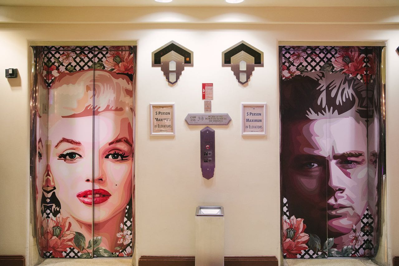 elevator doors with pictures of people on them