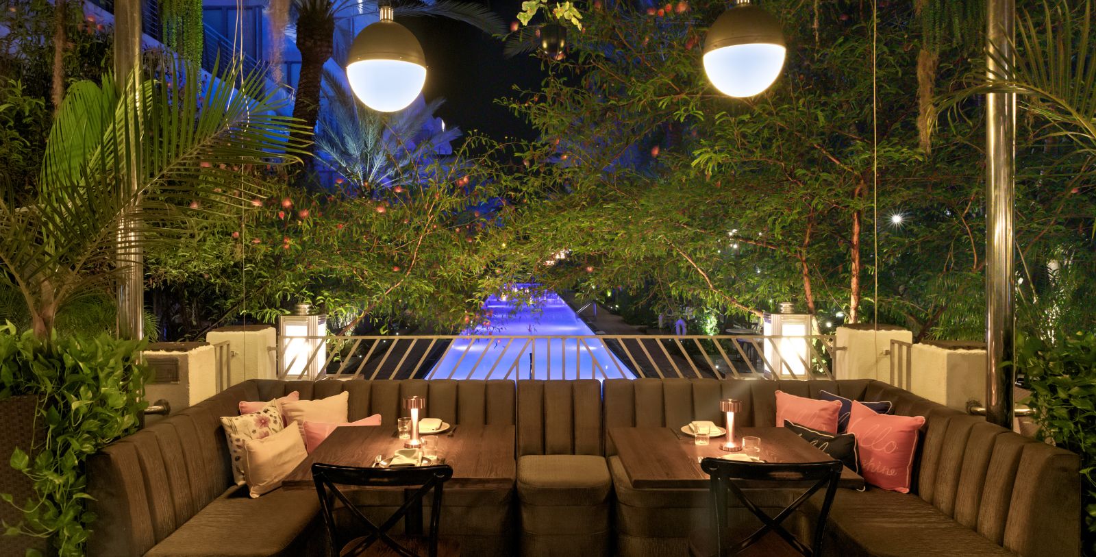 a table and chairs under a tree